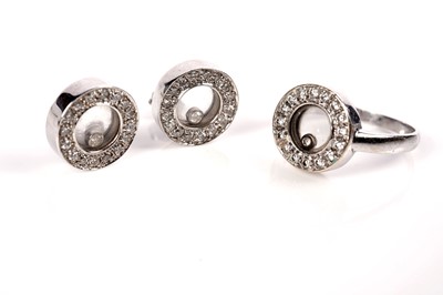 Lot 1260 - A Chopard Happy Diamonds style ring and earrings