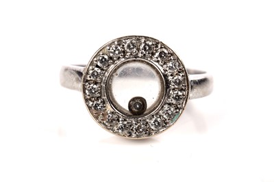 Lot 1260 - A Chopard Happy Diamonds style ring and earrings