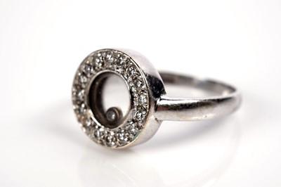 Lot 1260 - A Chopard Happy Diamonds style ring and earrings
