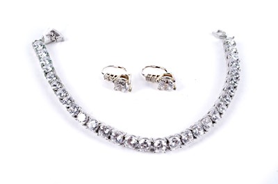 Lot 235 - A white stone tennis bracelet; and a pair of earrings