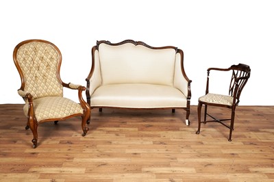 Lot 20 - A Victorian carved mahogany high-back settee and two armchairs