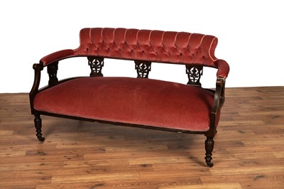 Lot 9 - A Victorian carved oak button back settee