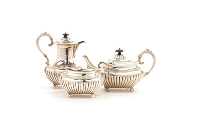 Lot 1490 - A late Victorian silver teapot, matching hot water jug and sugar basin