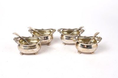 Lot 1546 - A set of four George III silver salts; and a set of four silver Fiddle pattern salt spoons