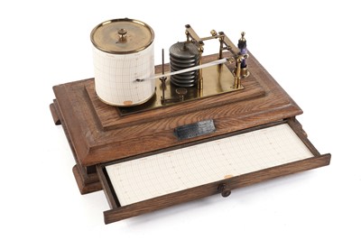 Lot 1153 - A barograph, in oak display case