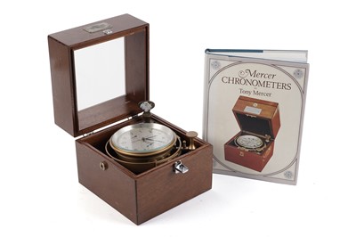 Lot 1157 - A mid-20th Century mahogany cased marine chronometer; and signed copy of ‘Mercer chronometers’