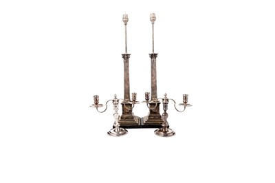 Lot 1382 - A pair of electroplated column lamps bases; and a pair of candelabra