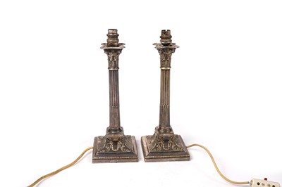 Lot 1383 - A pair of late Victorian electroplated lamps