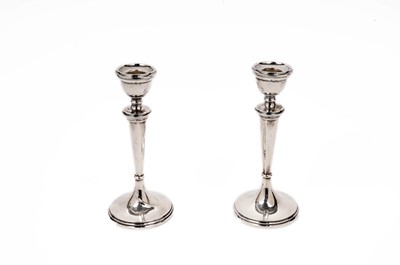 Lot 847 - A pair of  George V silver candle sticks