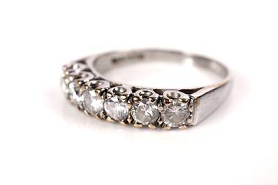 Lot 1090 - A six stone diamond ring