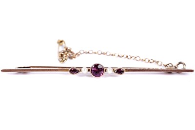 Lot 31 - A purple paste and seed pearl bar brooch