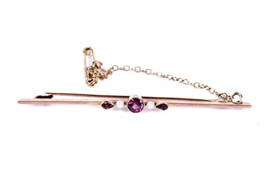 Lot 31 - A purple paste and seed pearl bar brooch