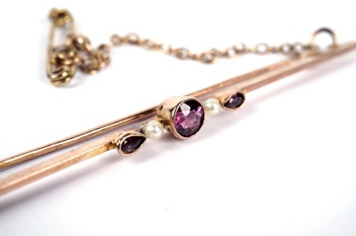 Lot 31 - A purple paste and seed pearl bar brooch