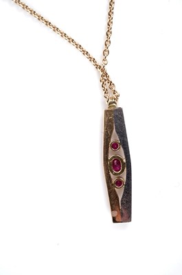 Lot 1087 - A ruby pendant and earrings