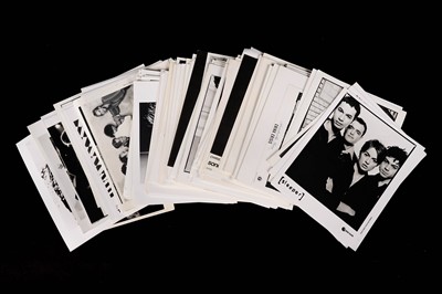 Lot 1348 - Record label promotional black and white photographs of bands and musicians