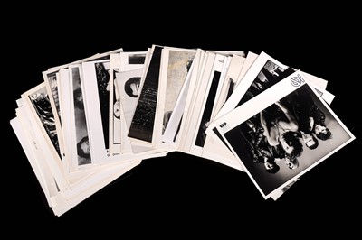 Lot 1351 - Record label promotional black and white photographs of bands and musicians
