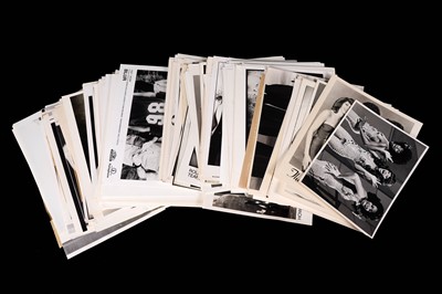 Lot 1356 - Record label promotional black and white photographs of bands and musicians