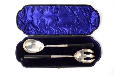 Lot 1651 - A late Victorian cased pair of silver salad servers