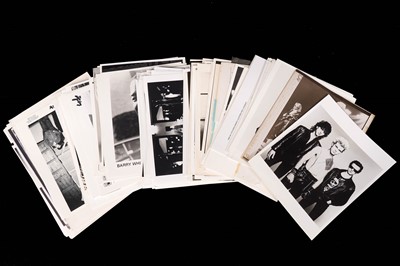 Lot 1357 - Record label promotional black and white photographs of bands and musicians