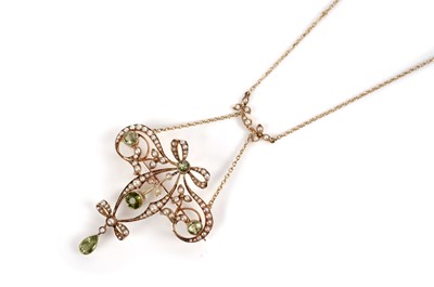 Lot 1091 - An Edwardian peridot and seed pearl pendant necklace with brooch fitting