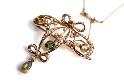 Lot 1091 - An Edwardian peridot and seed pearl pendant necklace with brooch fitting