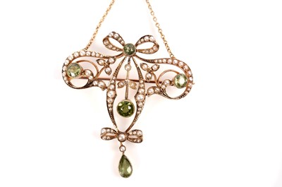 Lot 1091 - An Edwardian peridot and seed pearl pendant necklace with brooch fitting