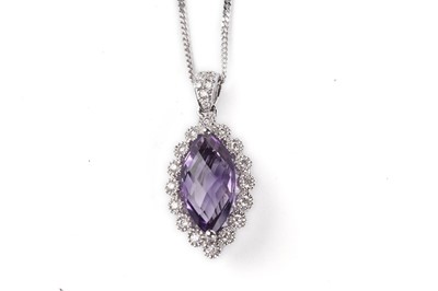 Lot 569 - An amethyst and diamond pendant necklace