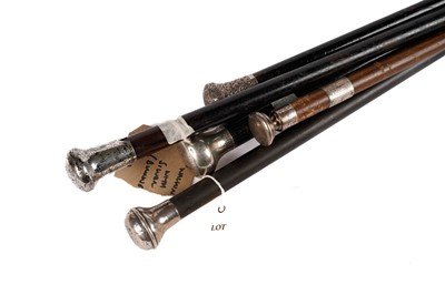 Lot 1018 - Five silver pommelled walking sticks