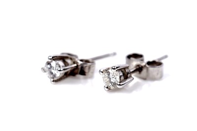 Lot 1269 - A pair of diamond stud earrings