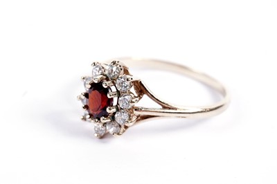 Lot 517 - A red tourmaline cluster ring