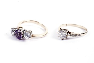 Lot 518 - An amethyst three-stone ring; and a solitaire