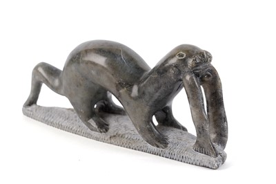 Lot 1499 - A 20th Century Canadian Inuit carved stone sculpture of an otter