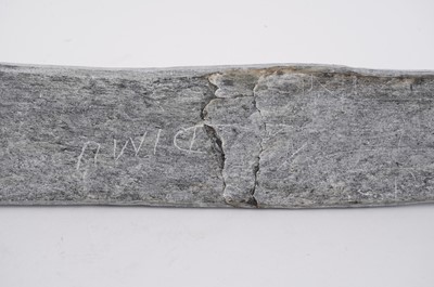Lot 1504 - A 20th Century Inuit stone carving of a figure on dog sled