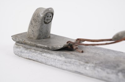 Lot 1504 - A 20th Century Inuit stone carving of a figure on dog sled