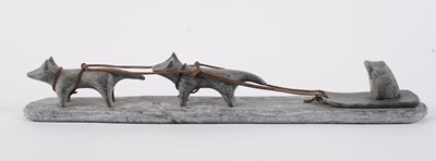 Lot 1504 - A 20th Century Inuit stone carving of a figure on dog sled
