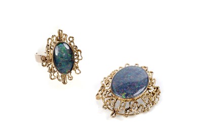 Lot 1096 - An opal and gold ring and brooch/pendant