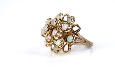 Lot 1097 - An opal cluster ring