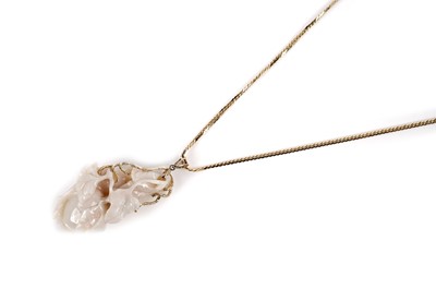 Lot 1103 - A Chinese carved white opal pendant