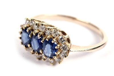 Lot 508 - A sapphire and diamond cluster ring