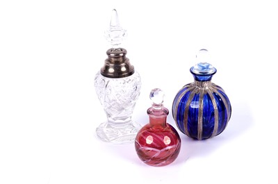 Lot 262 - A selection of cut-glass scent bottles including: a George V scent bottle