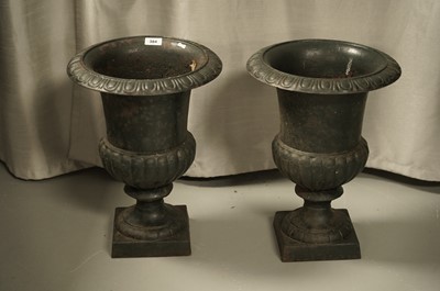 Lot 384 - A pair of Classical style cast iron garden urns