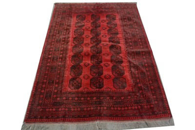 Lot 1185 - A hand-made Afghan carpet