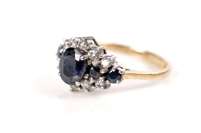 Lot 1283 - A sapphire and diamond ring