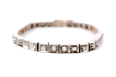 Lot 1284 - A diamond tennis bracelet