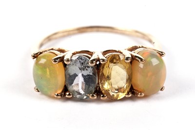 Lot 483 - A water-opal and gem-stone ring