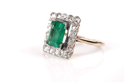 Lot 1224 - An emerald and diamond square cluster ring