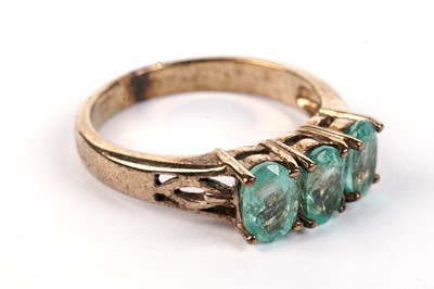 Lot 484 - A three-stone emerald ring