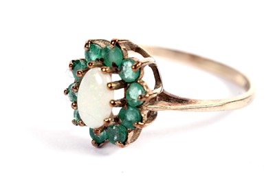 Lot 438 - An opal and emerald cluster ring