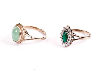 Lot 442 - A jade-coloured stone ring; and a green and white stone cluster ring