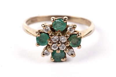 Lot 477 - An emerald and diamond dress ring